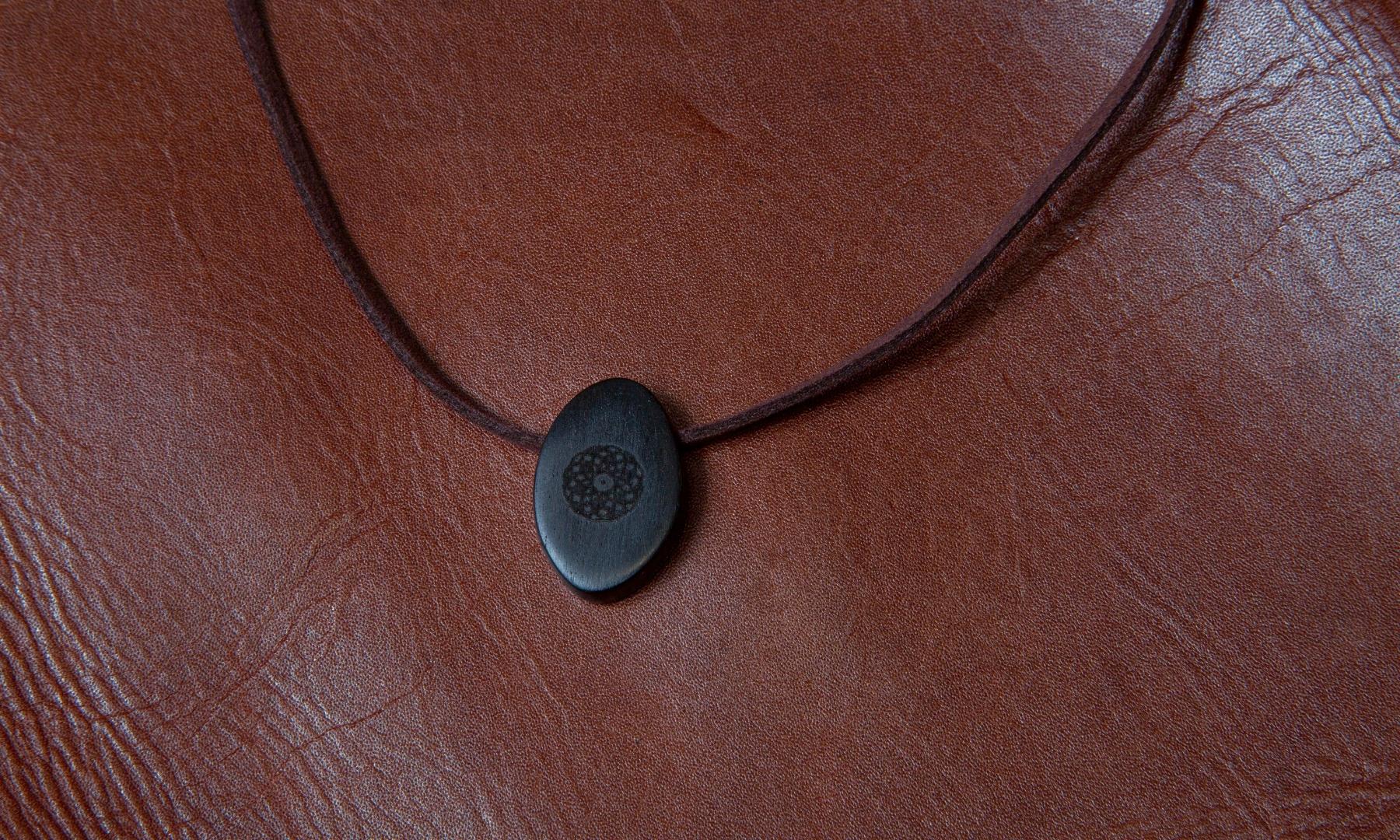 Torus Design in Ebony - ORB Pendant on red